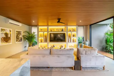 a living room with two white couches at The Plaza 4BR With Pool in Bali s Eat Street in Seminyak