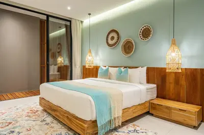 a bedroom with a large bed in a room at The Plaza 4BR With Pool in Bali s Eat Street in Seminyak