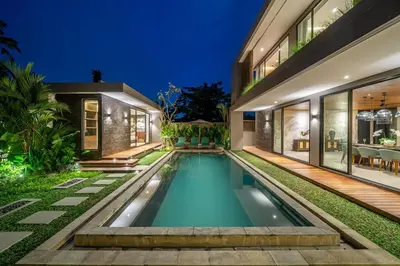 an indoor swimming pool in the backyard of a house at The Plaza 4BR With Pool in Bali s Eat Street in Seminyak