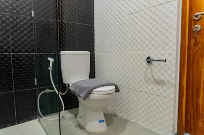 a bathroom with a toilet with a towel on it at NEW! Queen Villa - 2BR Villa in Seminyak in Seminyak