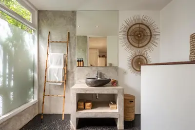 a bathroom with a sink and a mirror at Renovated Villa Zayya, Central Oberoi Seminyak in Seminyak
