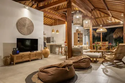 a living room with a tv and a couch at Renovated Villa Zayya, Central Oberoi Seminyak in Seminyak
