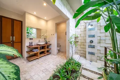 a bathroom with a sink and a toilet at Villa Bettini Stylish 3BR with Pool Near Bintang in Seminyak