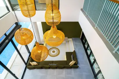 an overhead view of a living room with hanging lights at New 3 Bedroom Villa with rooftop central Seminyak in Seminyak