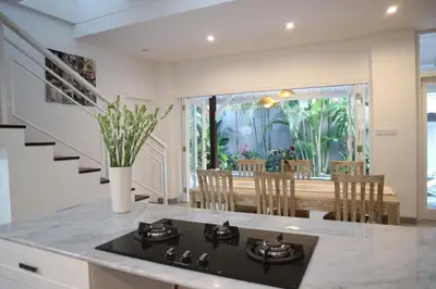 a kitchen with a stove top oven in a room at New 3BR Orchid Private Pool Villa Seminyak in Seminyak