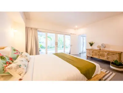a bedroom with a large bed and a large window at New 3BR Orchid Private Pool Villa Seminyak in Seminyak
