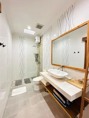 a bathroom with a sink and a toilet at Villa Karma Damai in Seminyak