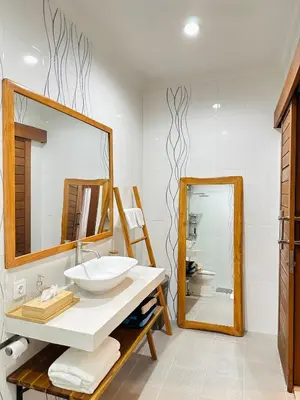 a bathroom with a sink and a mirror at Villa Karma Damai in Seminyak