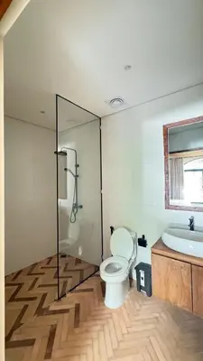 a bathroom with a toilet and a sink at Tuluscoliving Villa Kuta 1, 4 Bedroom & 5 Bathroom in Ngurah Rai International Airport