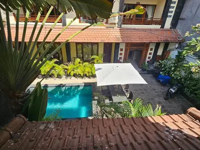an aerial view of a house with a swimming pool at Cempaka Apartment Surfaris Inn in Legian