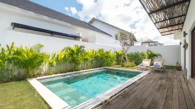 a swimming pool in the backyard of a house at Villa Lange 3 by Villa Finder in Seminyak