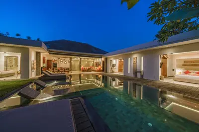 an exterior view of a house with a swimming pool at PROMO - 4 Bedroom Designer Villa 2 minutes to Berawa Beach & Finns in Canggu