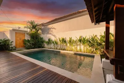 a swimming pool in the backyard of a house at Arvi Villa Pandawa Legian in Legian