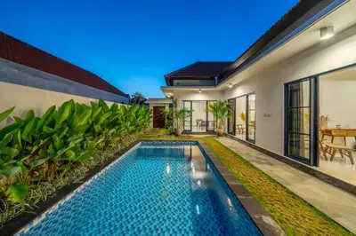 a swimming pool in the backyard of a villa at Alicia - Stylish 2BR Villa with Large Pool in Kerobokan