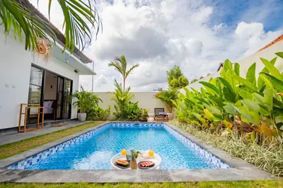 a swimming pool in the backyard of a villa at Alicia - Stylish 2BR Villa with Large Pool in Kerobokan