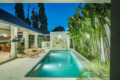 a swimming pool in the backyard of a house at Coral Heaven 1 by Bali Villa Solutions in Seminyak