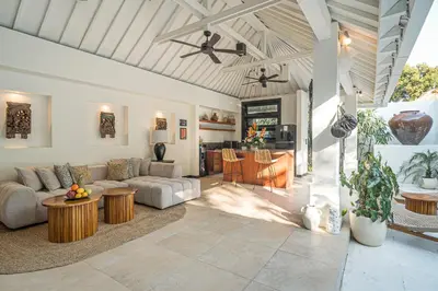 a living room with a couch and a table at Coral Heaven 1 by Bali Villa Solutions in Seminyak