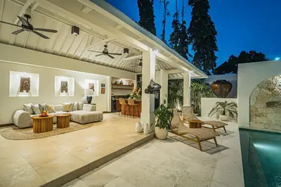 a living room with a pool and a patio at Coral Heaven 1 by Bali Villa Solutions in Seminyak