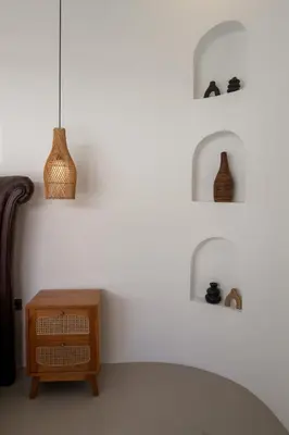 a room with a table and some vases on the wall at Villa Grace a 2BR Retreat with private pool in Seminyak
