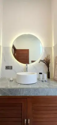 a bathroom with a white sink and a mirror at Modern Tropical 2 Bedroom Villa Ocean Nest in Canggu