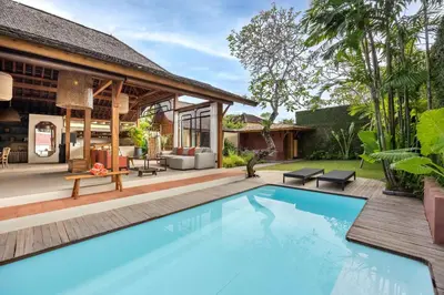 an image of a swimming pool in front of a house at Villa Camini - Newly Renovated Beautiful 2BR Family Villa 6px With Garden And Private Pool in Kerobokan
