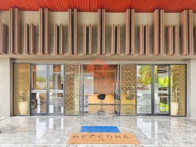a lobby with a reception desk in a building at Lavaya Resort 1BR Nusa Dua with Pool, WiFi, Netflix by 2ndHome in Nusa Dua