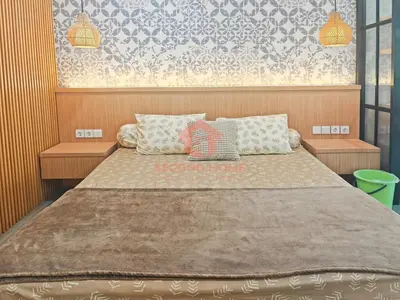 a bedroom with a large bed with two pillows at Lavaya Resort 1BR Nusa Dua with Pool, WiFi, Netflix by 2ndHome in Nusa Dua