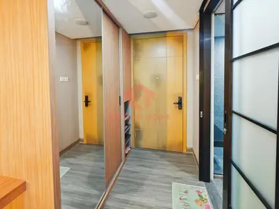 a hallway with a glass door leading into a room at Lavaya Resort 1BR Nusa Dua with Pool, WiFi, Netflix by 2ndHome in Nusa Dua