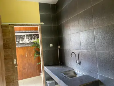 a kitchen with a sink and a counter top at P Hotel Kuta-3minutes to the beach by Micky Studio in Legian