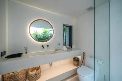 a bathroom with a sink and a mirror at Villa Luuma 3 - Cozy Umalas Oasis, 1BR Private Villa in Canggu