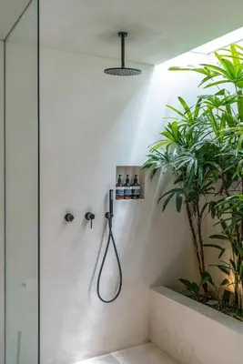 a shower in a bathroom with plants in it at Villa Luuma 3 - Cozy Umalas Oasis, 1BR Private Villa in Canggu