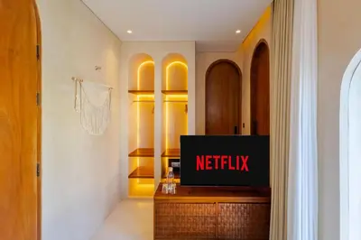 a television on a dresser in a dressing room at Villa San Miguel by Pertama Management in Seminyak