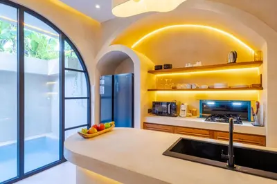 a kitchen with a sink and a window at Villa Santa Clara by Pertama Management in Seminyak