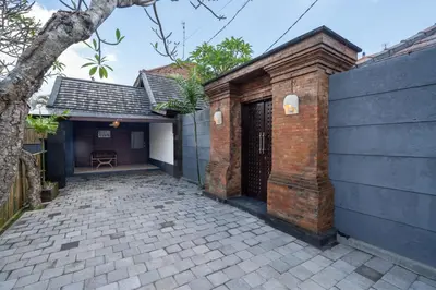 an external view of a house with a brick building at Villa jepun berawa in Canggu