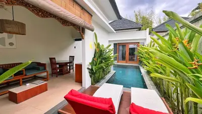 a swimming pool in the middle of a house at Maharaja Villas Seminyak by Humus Hospitality in Kerobokan