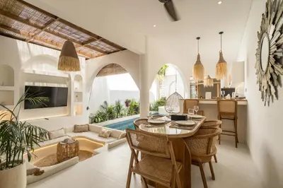 a kitchen and living room with a table and chairs at Brand New Villa 2BR with Private Pool near Seminyak by BaliSuperHost in Seminyak