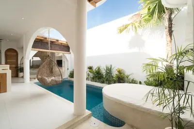 a pool in a villa with a swing at Brand New Villa 2BR with Private Pool near Seminyak by BaliSuperHost in Seminyak