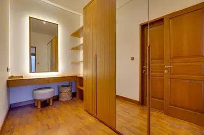 a bathroom with a mirror and a wooden door at New! Villa Taman Seminyak 01 near Double Six Beach in Seminyak