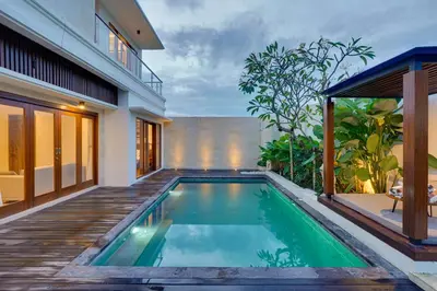 a swimming pool in the backyard of a house at New! Villa Taman Seminyak 01 near Double Six Beach in Seminyak