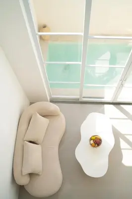 a white chair in a room with a window at Villa Azura in Perean