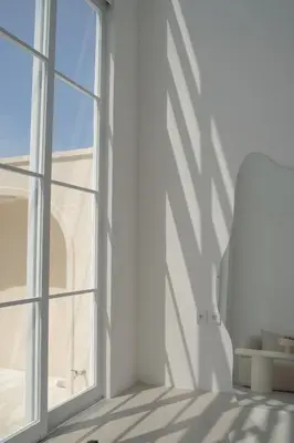 an empty room with a window and a chair at Villa Azura in Perean