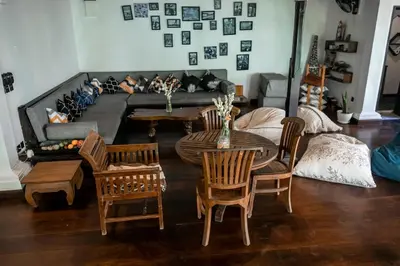 a living room with a couch and a table and chairs at My secret home ( full villa) in Seminyak