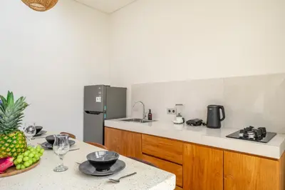a kitchen with a table with a bowl of fruit at A26 - Private Pool Villa in Seminyak in Seminyak