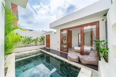 a swimming pool in a villa with a bedroom at A26 - Private Pool Villa in Seminyak in Seminyak