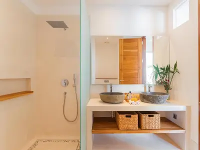 two sinks in a bathroom with a shower at Lux 500sqm 5BR Villa, 400m to FINNS & Canggu Beach in Canggu