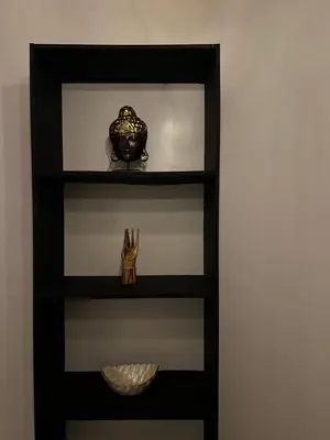 a shelf with a pot and a bowl on it at Villa Mawar Seminyak in Seminyak