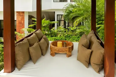 a room with pillows and a table at Balidroomvilla Sanur Mangrove - Full Serviced - Beachside in Sanur
