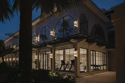an exterior view of a house at night at Hygge Hotel and Villas Seminyak in Seminyak