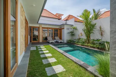 an image of a backyard with a swimming pool and a house at Villa Mailaku Seminyak in Seminyak