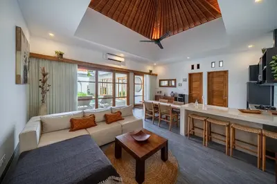 a living room with a couch and a table at Villa Mailaku Seminyak in Seminyak